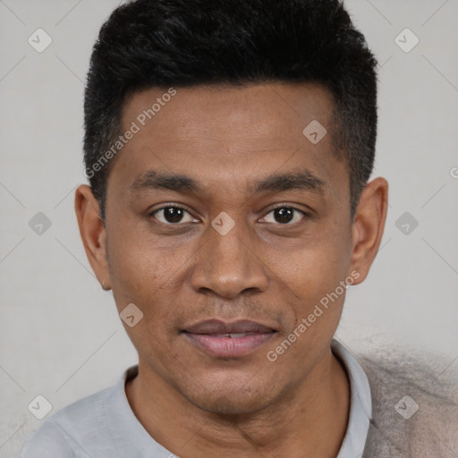 Joyful black young-adult male with short  black hair and brown eyes