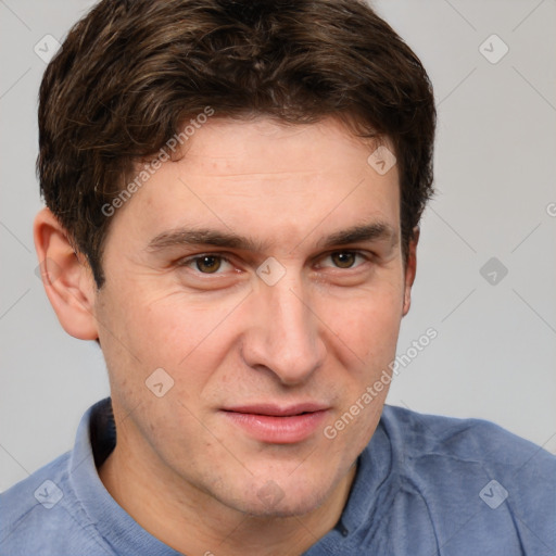 Joyful white adult male with short  brown hair and grey eyes