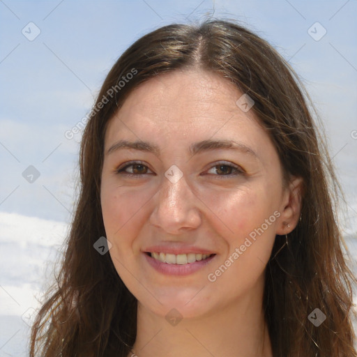 Joyful white adult female with long  brown hair and brown eyes