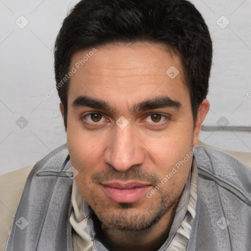 Joyful white young-adult male with short  black hair and brown eyes