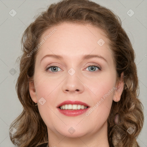 Joyful white young-adult female with long  brown hair and blue eyes