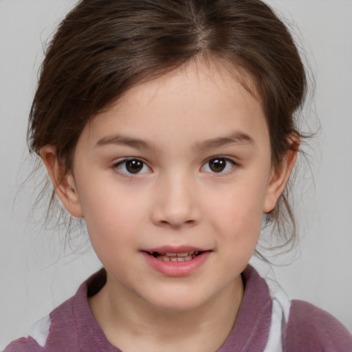 Joyful white child female with medium  brown hair and brown eyes