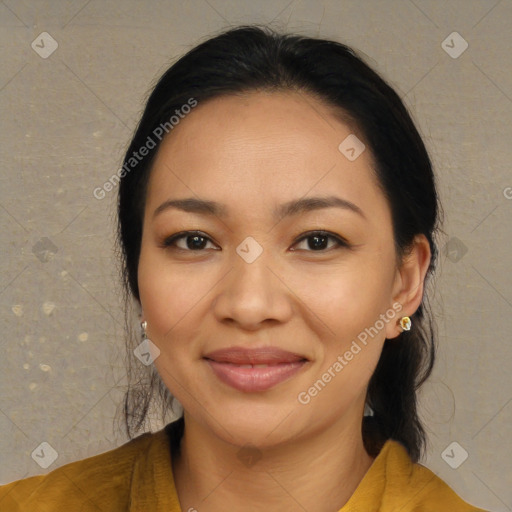 Joyful latino young-adult female with long  brown hair and brown eyes