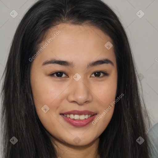 Joyful asian young-adult female with long  brown hair and brown eyes