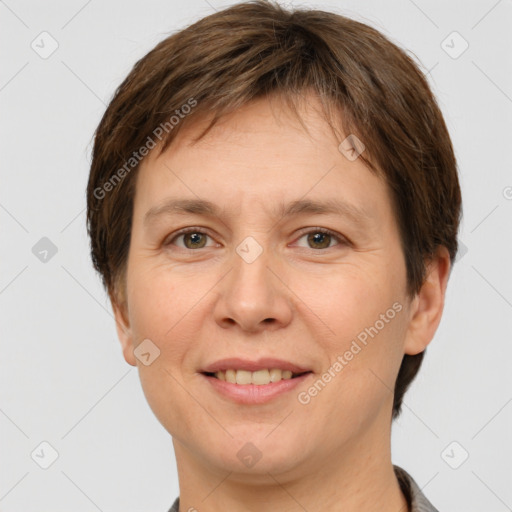 Joyful white adult female with short  brown hair and brown eyes