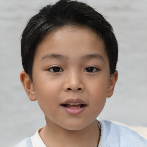 Joyful asian child female with short  brown hair and brown eyes