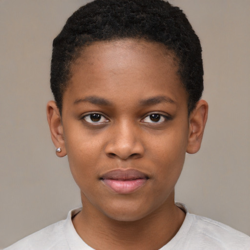 Joyful black child female with short  black hair and brown eyes