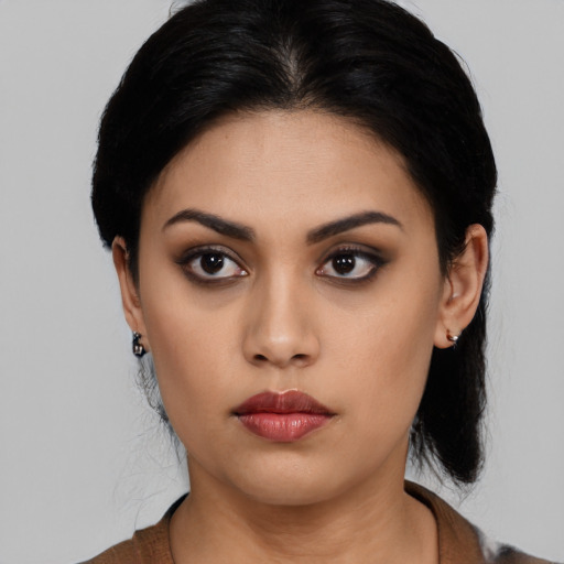 Neutral latino young-adult female with medium  black hair and brown eyes