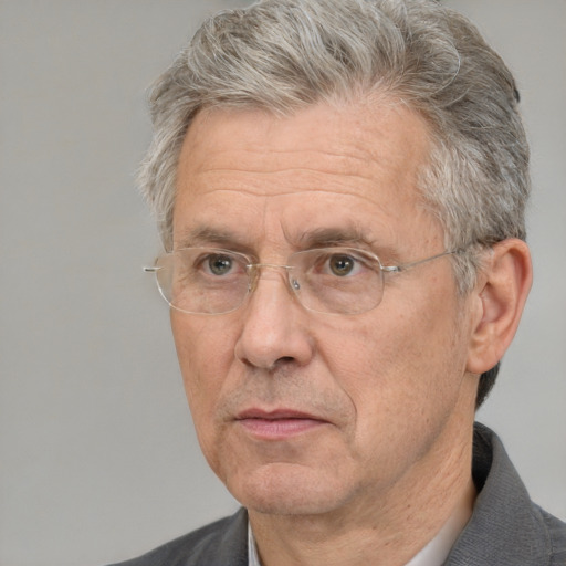 Neutral white middle-aged male with short  gray hair and brown eyes