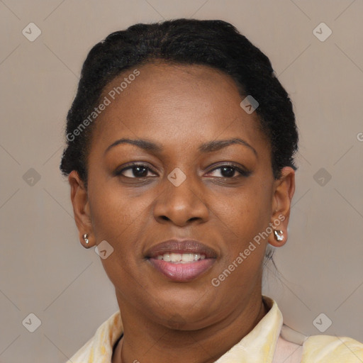 Joyful black adult female with short  brown hair and brown eyes