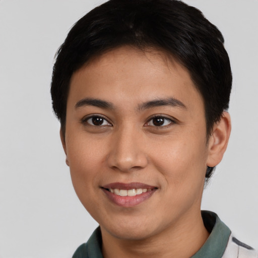 Joyful asian young-adult female with short  black hair and brown eyes