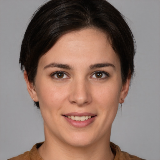 Joyful white young-adult female with medium  brown hair and brown eyes