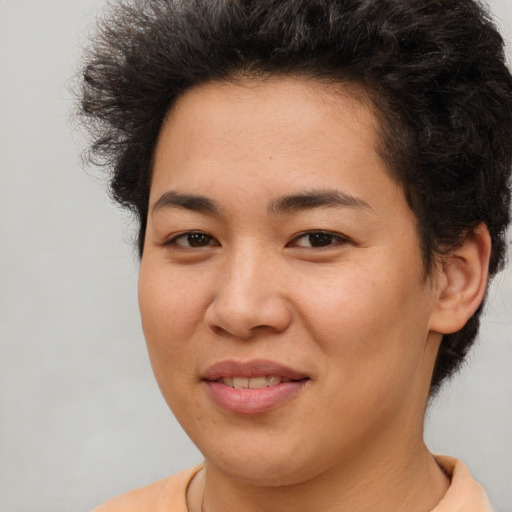 Joyful asian young-adult female with short  brown hair and brown eyes