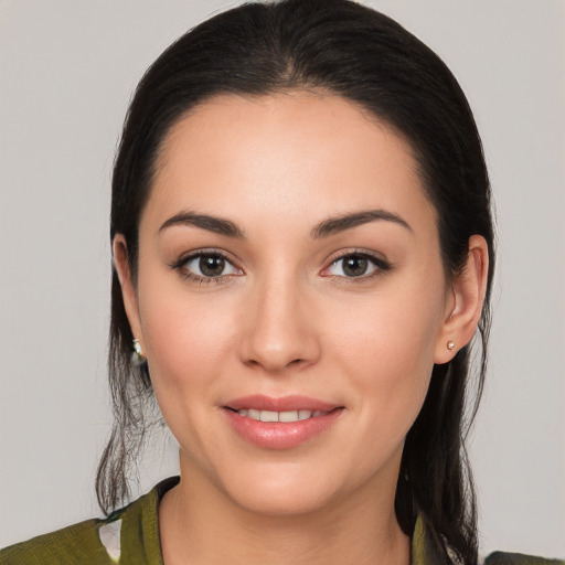 Joyful white young-adult female with medium  brown hair and brown eyes