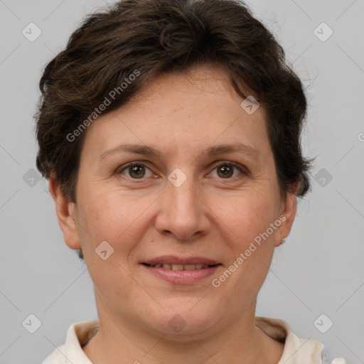 Joyful white adult female with short  brown hair and brown eyes