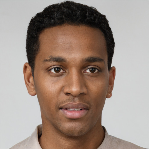 Neutral black young-adult male with short  black hair and brown eyes