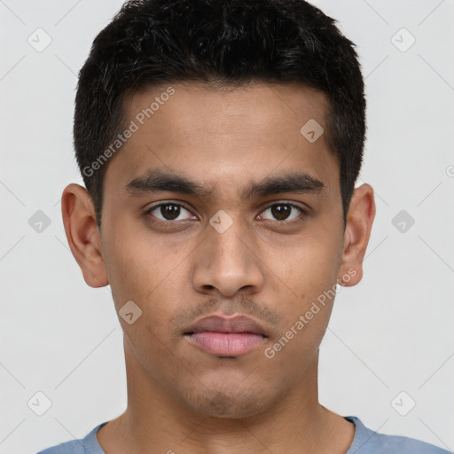 Neutral latino young-adult male with short  brown hair and brown eyes