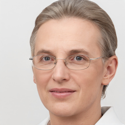 Joyful white adult female with short  brown hair and grey eyes