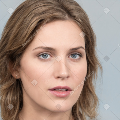 Neutral white young-adult female with long  brown hair and blue eyes