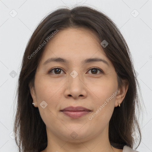 Joyful white adult female with long  brown hair and brown eyes