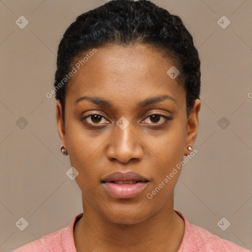 Joyful black young-adult female with short  black hair and brown eyes