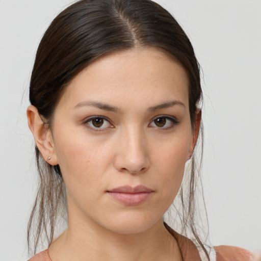 Neutral white young-adult female with medium  brown hair and brown eyes