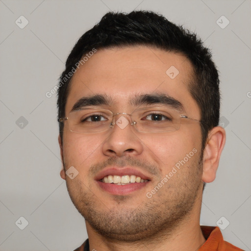 Joyful white young-adult male with short  black hair and brown eyes