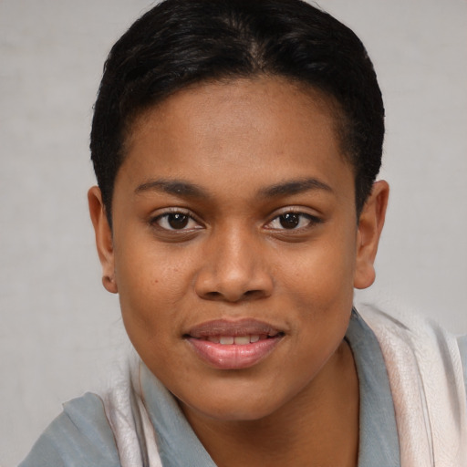 Joyful black young-adult female with short  brown hair and brown eyes