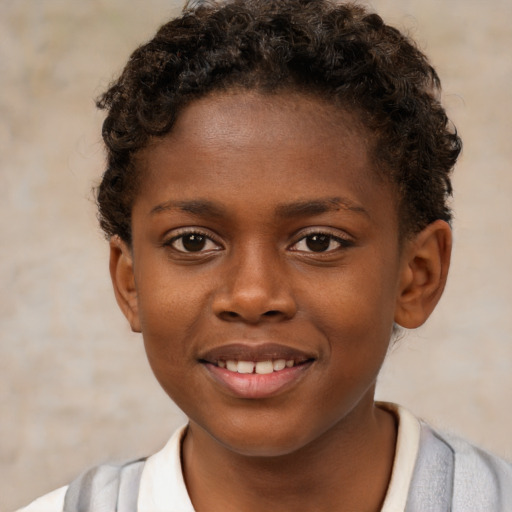 Joyful black child female with short  brown hair and brown eyes