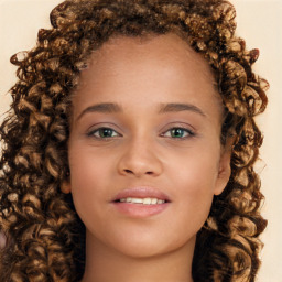 Joyful white child female with long  brown hair and brown eyes