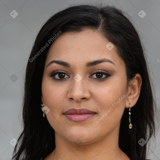 Joyful latino young-adult female with long  brown hair and brown eyes
