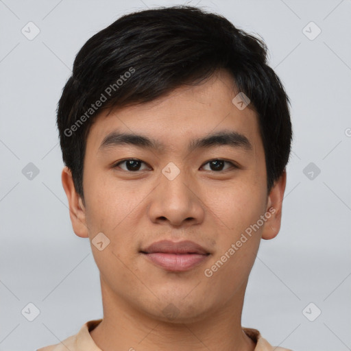 Joyful asian young-adult male with short  black hair and brown eyes