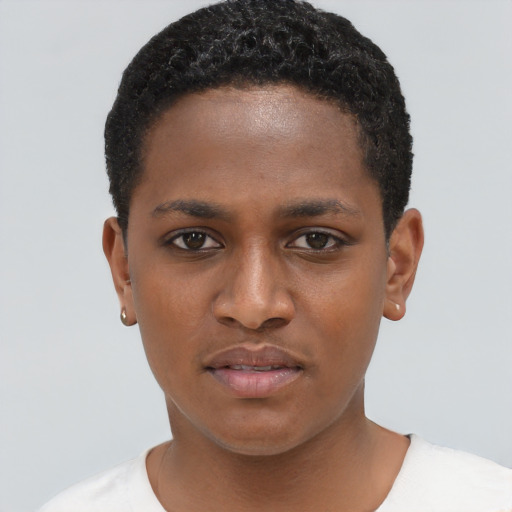 Joyful black young-adult female with short  brown hair and brown eyes