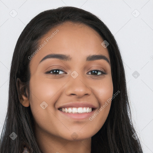 Joyful latino young-adult female with long  black hair and brown eyes