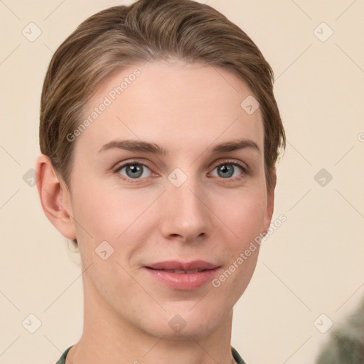 Joyful white young-adult female with short  brown hair and grey eyes