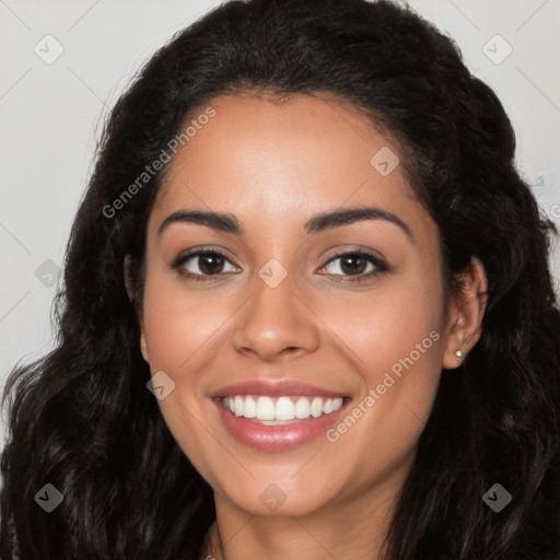 Joyful latino young-adult female with long  black hair and brown eyes