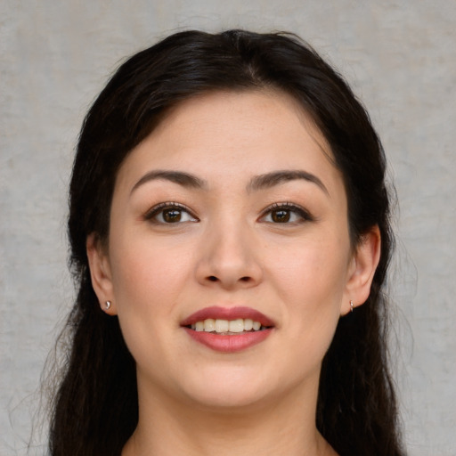 Joyful white young-adult female with medium  brown hair and brown eyes