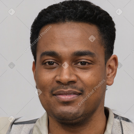 Joyful black young-adult male with short  black hair and brown eyes