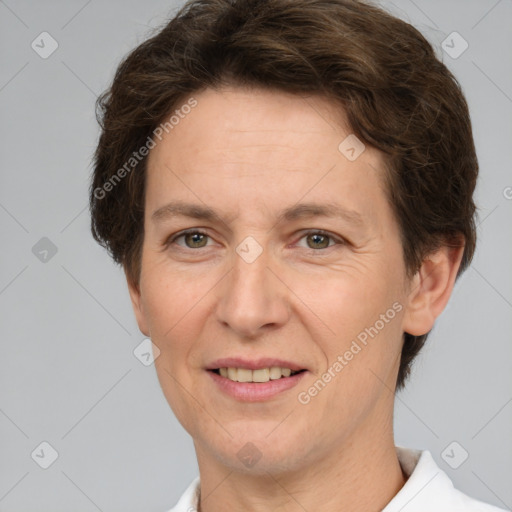 Joyful white adult female with short  brown hair and brown eyes