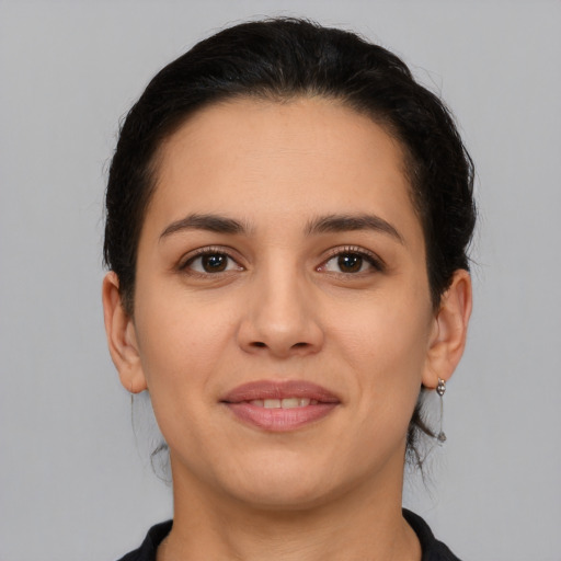 Joyful white young-adult female with medium  brown hair and brown eyes