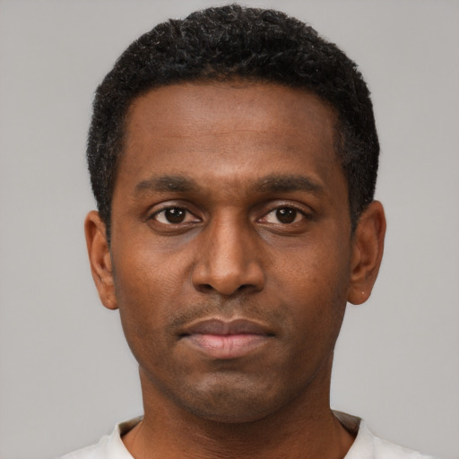 Neutral black young-adult male with short  brown hair and brown eyes