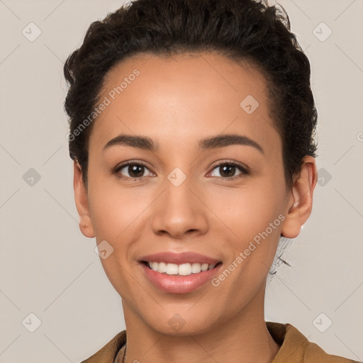 Joyful white young-adult female with short  brown hair and brown eyes