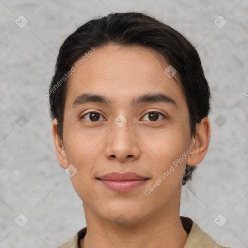 Joyful latino young-adult male with short  black hair and brown eyes