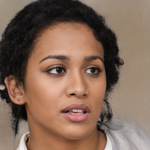 Neutral latino young-adult female with medium  brown hair and brown eyes