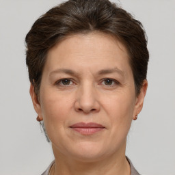 Joyful white adult female with short  brown hair and brown eyes