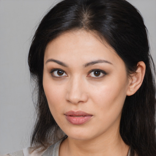 Neutral asian young-adult female with medium  brown hair and brown eyes