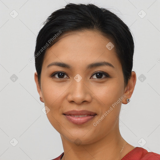 Joyful latino young-adult female with short  black hair and brown eyes