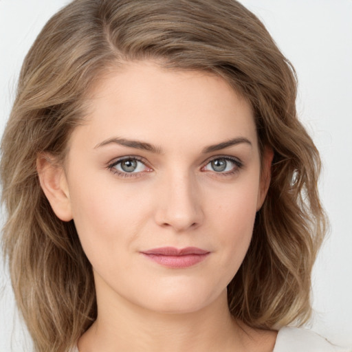 Joyful white young-adult female with medium  brown hair and blue eyes