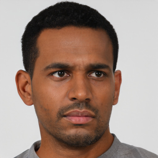 Neutral black young-adult male with short  black hair and brown eyes