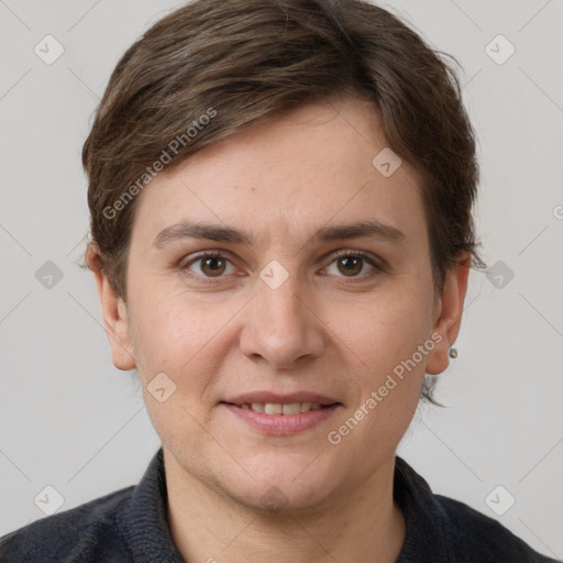 Joyful white young-adult female with short  brown hair and grey eyes